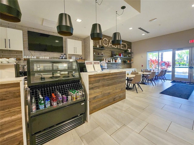 15625 San Lazzaro Ave, Bradenton, FL 34211 - kitchen with decorative backsplash, open shelves, white cabinetry, pendant lighting, and recessed lighting