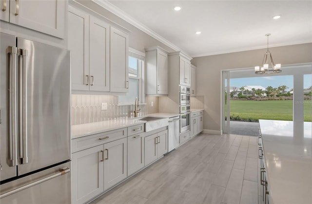 15625 San Lazzaro Ave, Bradenton, FL 34211 - kitchen featuring appliances with stainless steel finishes, healthy amount of natural light, light countertops, a chandelier, and recessed lighting