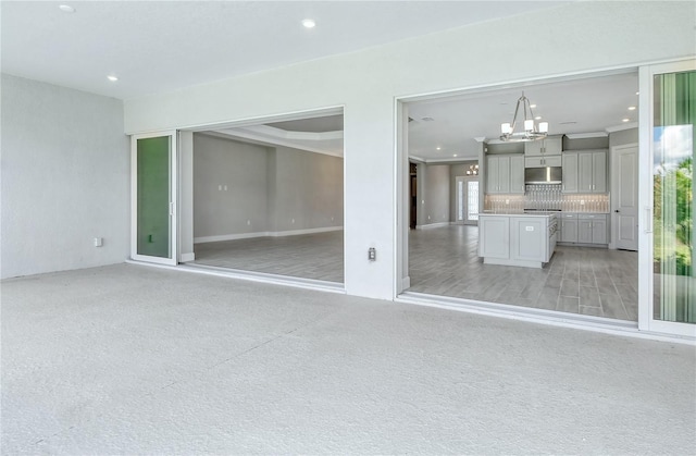 15625 San Lazzaro Ave, Bradenton, FL 34211 - unfurnished living room with a chandelier and recessed lighting