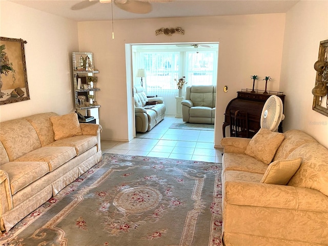 tiled living room with ceiling fan