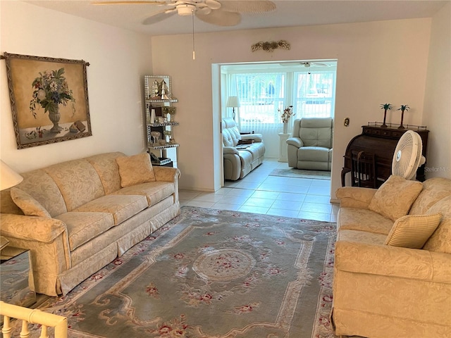 tiled living room featuring ceiling fan