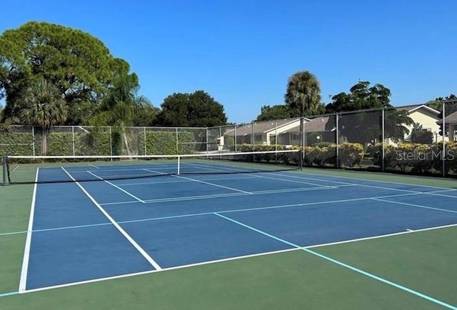 view of sport court with basketball hoop