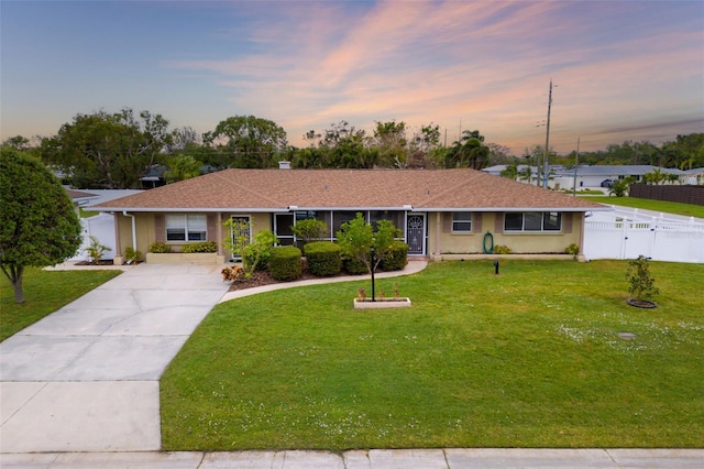 ranch-style house with a yard