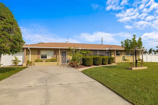 ranch-style home with a front lawn