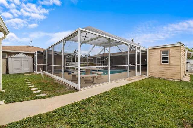 exterior space with a storage unit, a lanai, a yard, and a patio area