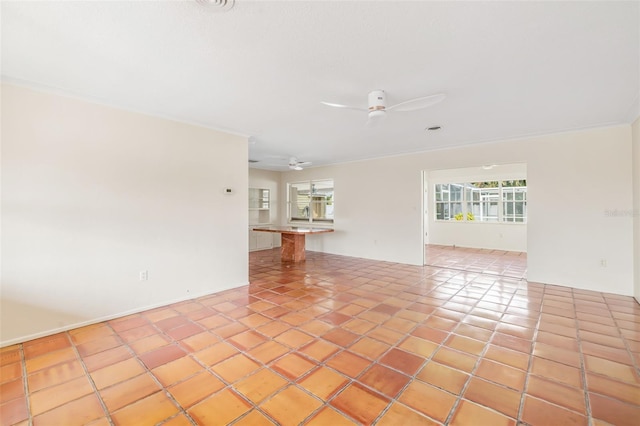 tiled empty room with ornamental molding