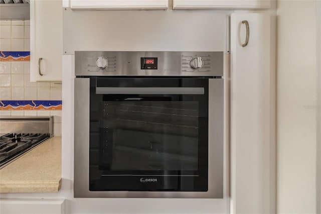 interior details featuring stainless steel appliances and tasteful backsplash