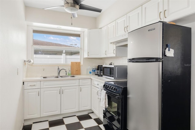 kitchen featuring tasteful backsplash, white cabinets, sink, and stainless steel appliances