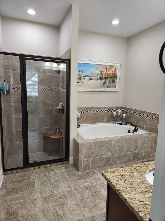 bathroom with vanity and plus walk in shower