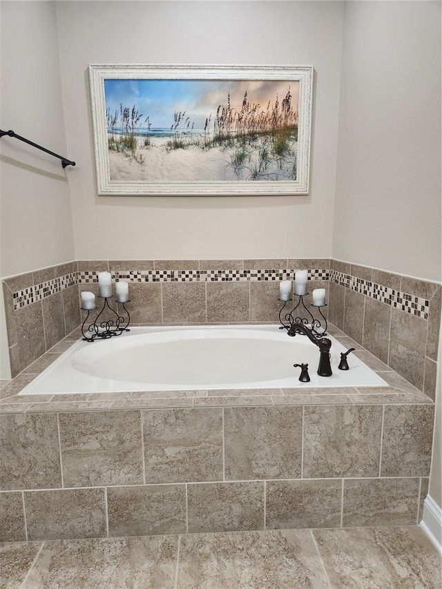 bathroom featuring tiled tub