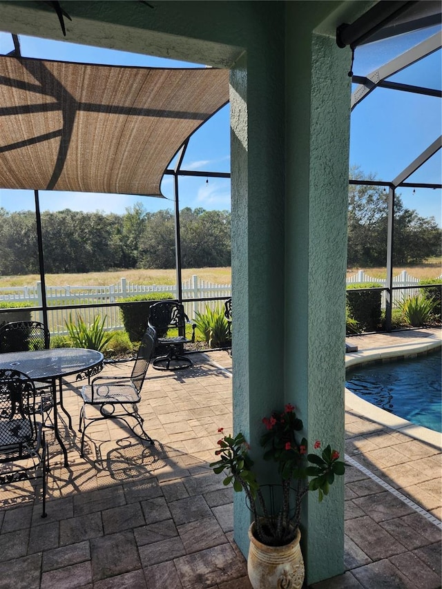 view of patio with a fenced in pool and a lanai