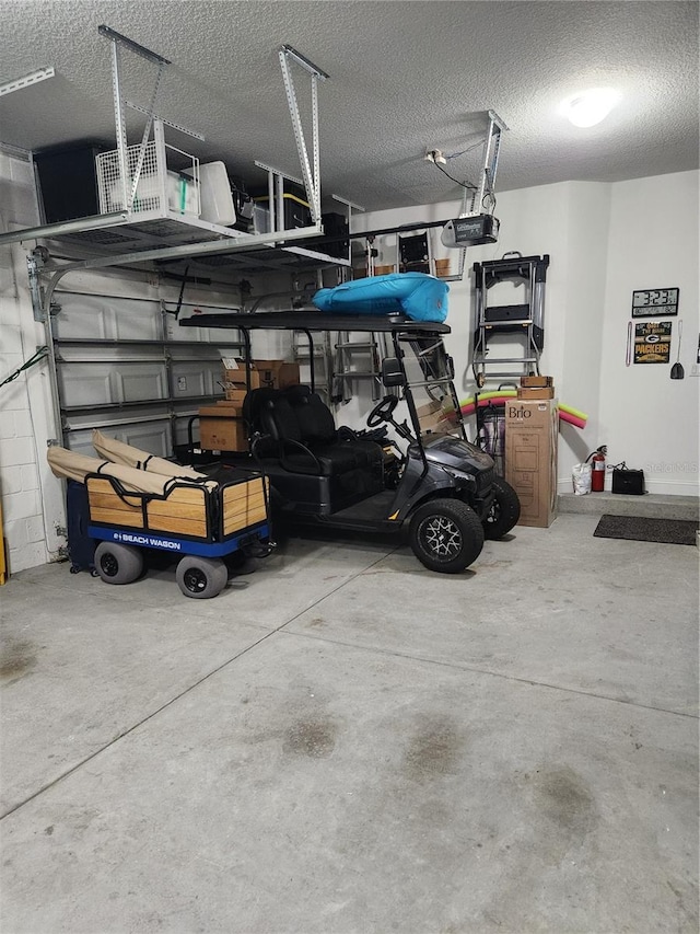 garage featuring a garage door opener