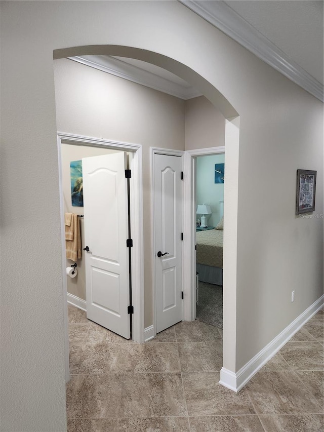 corridor featuring ornamental molding