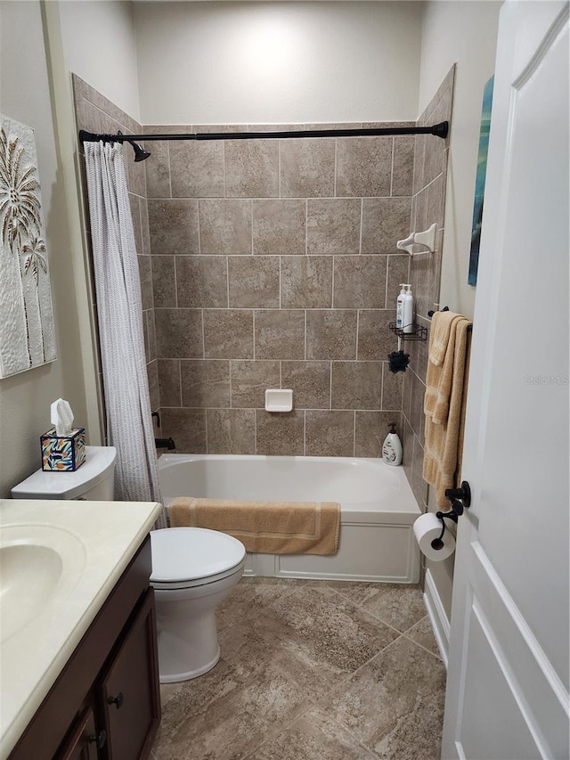 full bathroom featuring vanity, shower / bath combination with curtain, and toilet