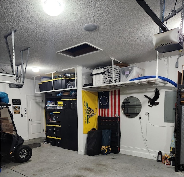 garage featuring electric panel and a garage door opener