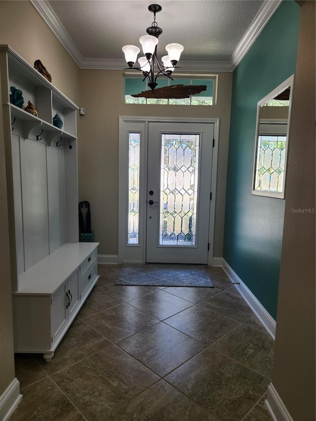 mudroom featuring a wealth of natural light, a notable chandelier, and crown molding