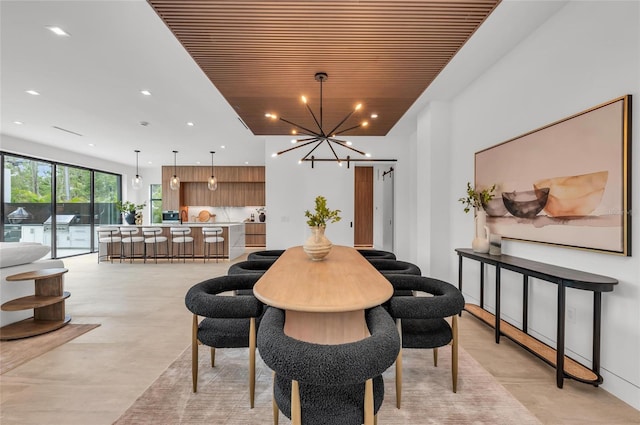 2038 Datura St, Sarasota, FL 34239 - dining room with wood ceiling, a chandelier, concrete flooring, and recessed lighting