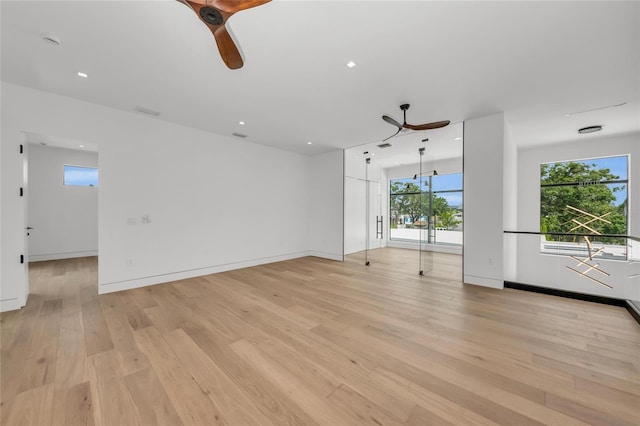 2038 Datura St, Sarasota, FL 34239 - unfurnished living room featuring a ceiling fan, baseboards, light wood finished floors, and recessed lighting