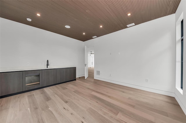 2038 Datura St, Sarasota, FL 34239 - interior space featuring light wood finished floors, a sink, visible vents, baseboards, and recessed lighting