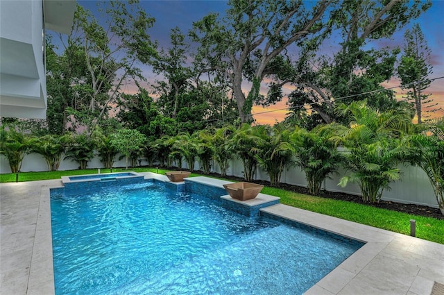 2038 Datura St, Sarasota, FL 34239 - pool at dusk featuring an in ground hot tub, a fenced in pool, and a fenced backyard