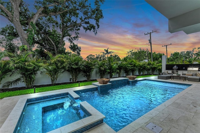 2038 Datura St, Sarasota, FL 34239 - pool at dusk featuring a fenced backyard, an outdoor hangout area, a patio, and a pool with connected hot tub