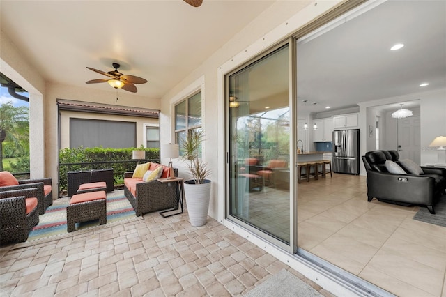 view of patio / terrace featuring an outdoor living space and ceiling fan