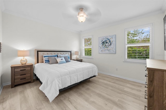 bedroom featuring ornamental molding, light hardwood / wood-style floors, multiple windows, and ceiling fan