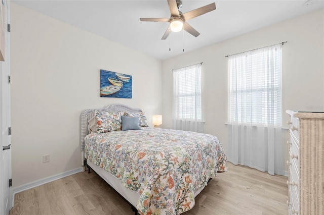 bedroom featuring light hardwood / wood-style floors and ceiling fan