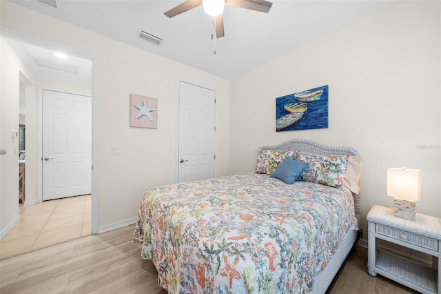 bedroom featuring light wood-type flooring and ceiling fan