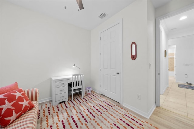 office space with ceiling fan and light hardwood / wood-style flooring