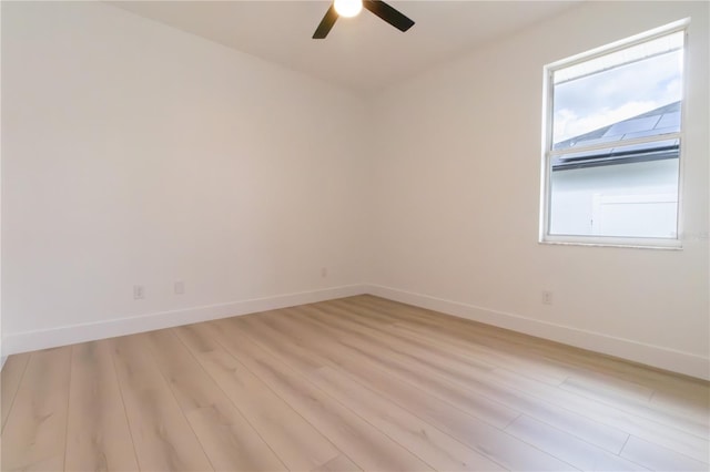 empty room with light hardwood / wood-style flooring and ceiling fan