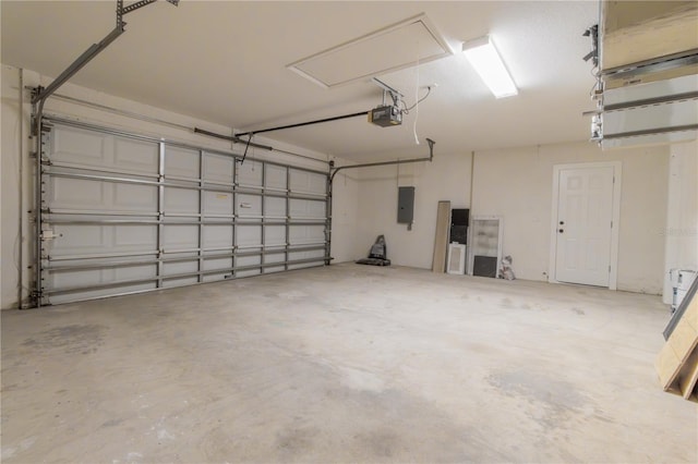 garage featuring a garage door opener and electric panel