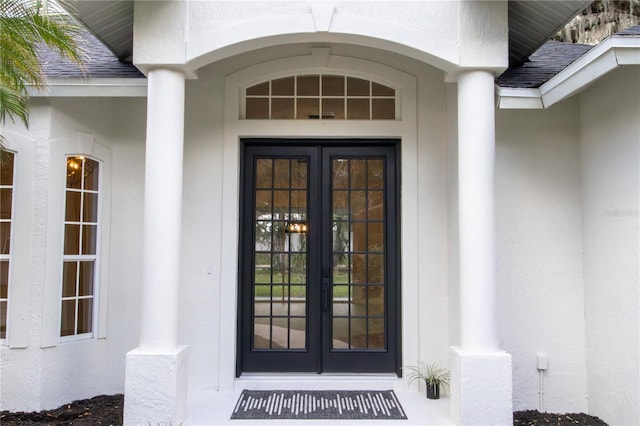 view of exterior entry featuring french doors