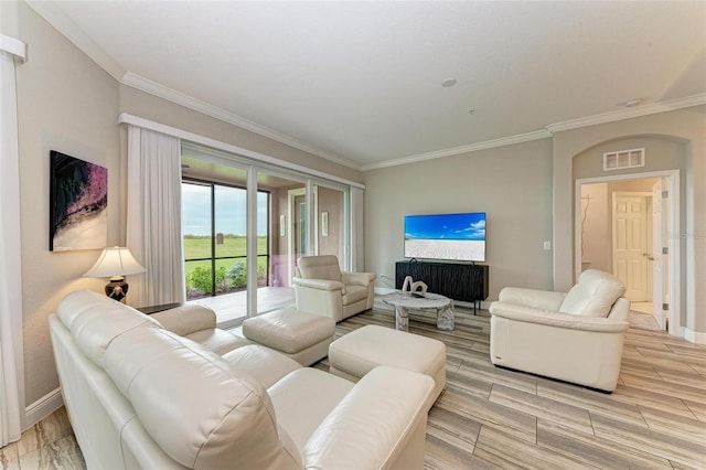 living room with light hardwood / wood-style floors and crown molding