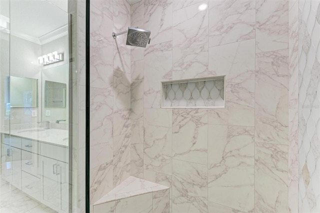 bathroom with vanity, tiled shower, and crown molding