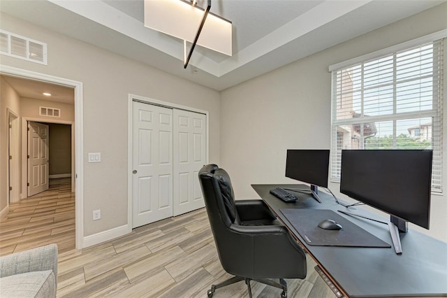 office area with light hardwood / wood-style flooring