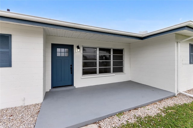 property entrance featuring a patio