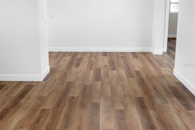 empty room featuring dark wood-type flooring