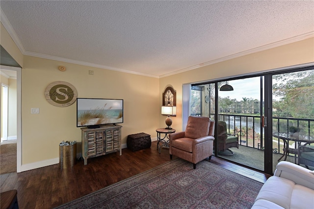 living room with dark hardwood / wood-style flooring, a textured ceiling, and crown molding