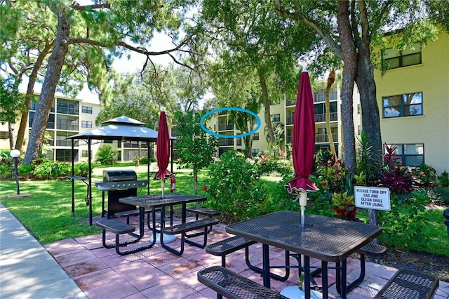 view of home's community featuring a patio and a yard