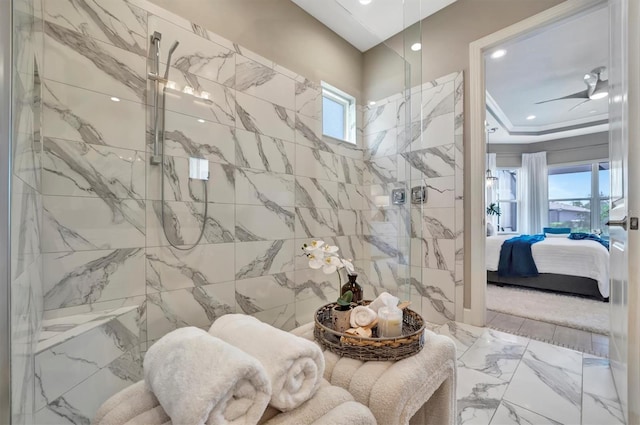 bathroom featuring ceiling fan, tile walls, and walk in shower