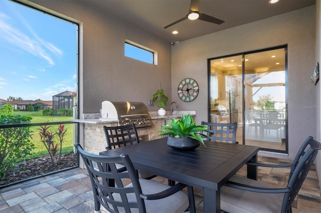 exterior space featuring ceiling fan and sink