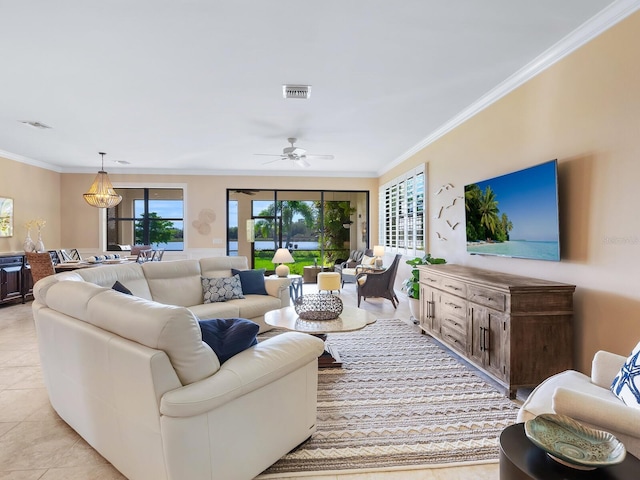 tiled living room featuring ornamental molding and ceiling fan