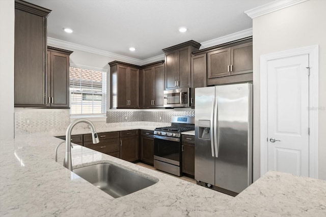 kitchen featuring sink, tasteful backsplash, dark brown cabinets, light stone counters, and stainless steel appliances