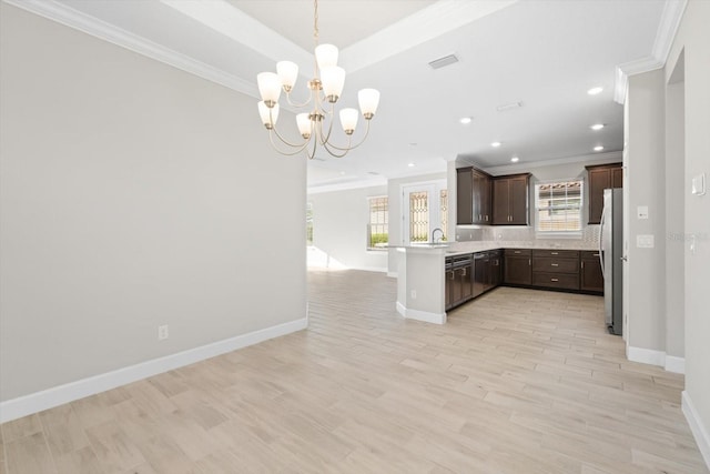 kitchen featuring kitchen peninsula, light hardwood / wood-style flooring, a notable chandelier, dark brown cabinetry, and stainless steel refrigerator