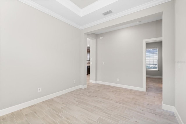 unfurnished room featuring crown molding and light hardwood / wood-style floors