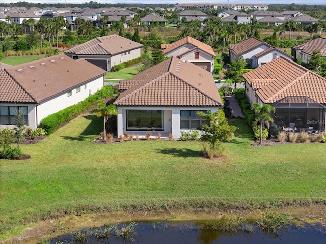 bird's eye view with a water view