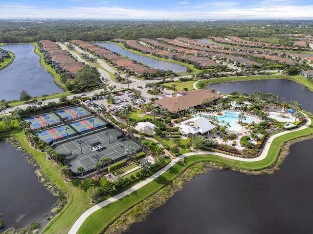 birds eye view of property with a water view