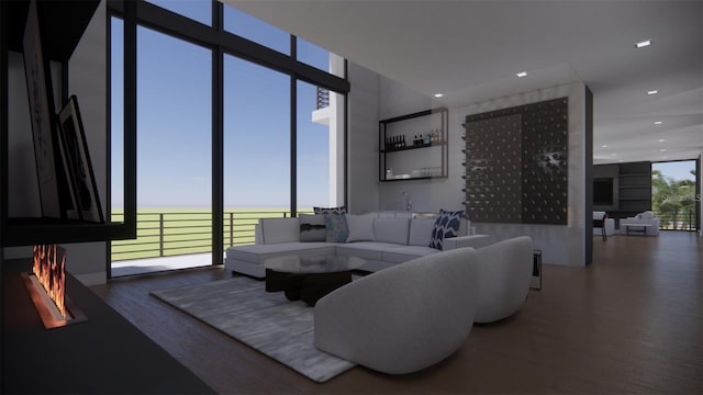 living room with hardwood / wood-style flooring and floor to ceiling windows