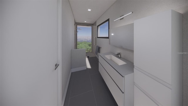 bathroom featuring tile patterned flooring and vanity